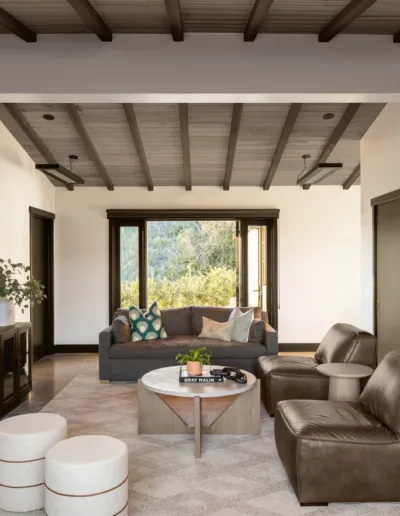 A living room with couches and a tv.